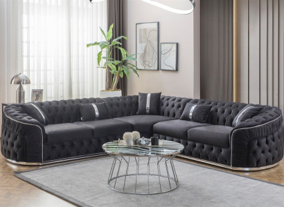 Schwarzer Ecksofa mit silbernen Elementen und geschwungenen Armlehnen