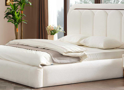 Modernes Bett mit weicher Kopfstütze in Weiß für ein stilvolles Schlafzimmer